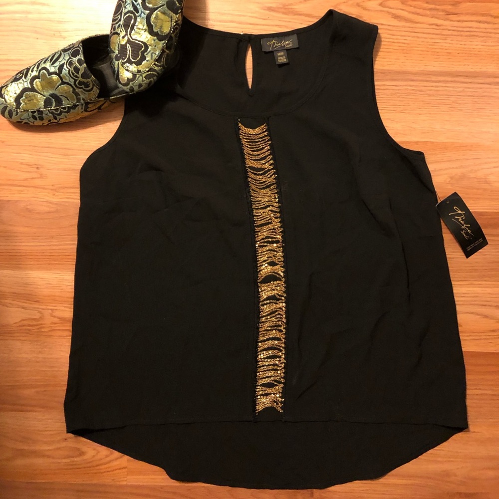 Black sleeveless top with gold chain column